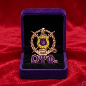 Omega Psi Phi Shield Lapel pin with letters.